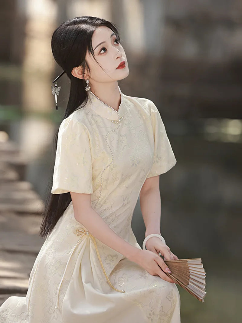 Elegant modern qipao dress in ivory with subtle jacquard texture
