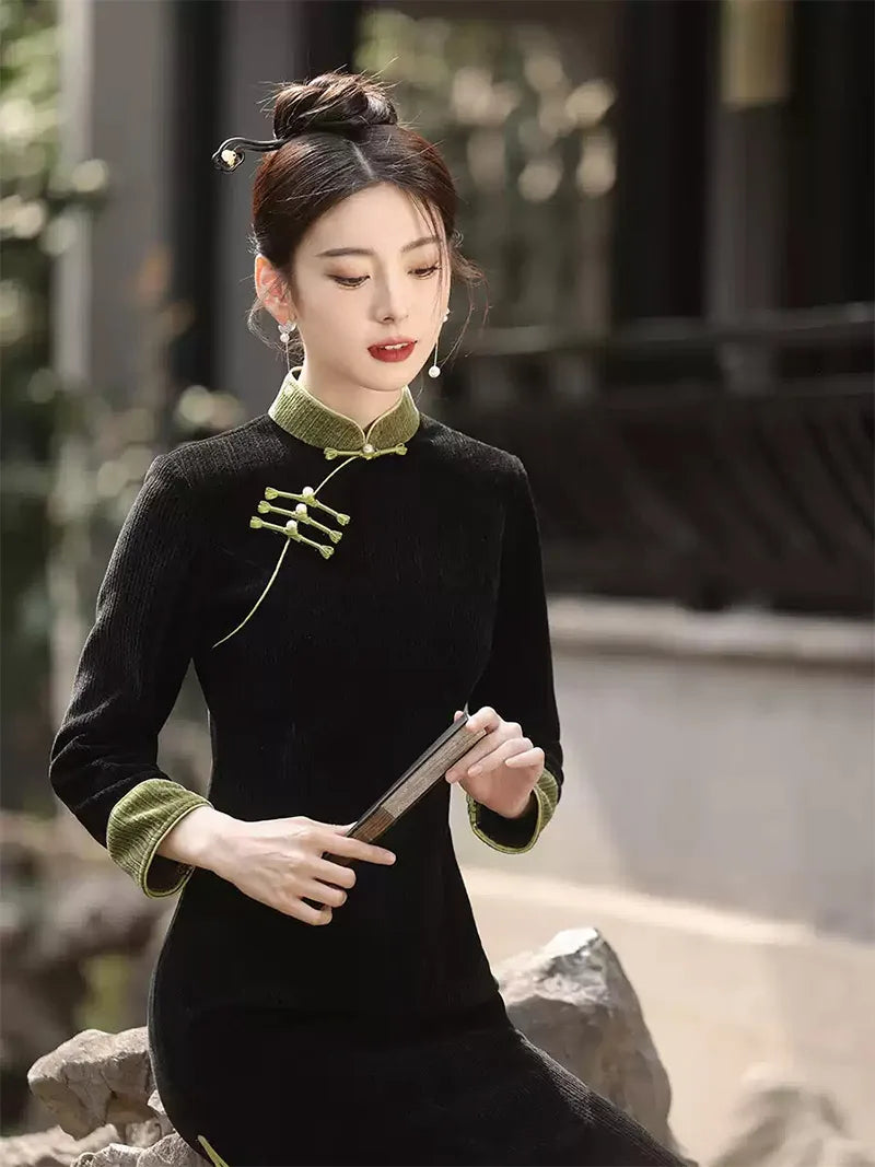 Qipao tea ceremony dress in black corduroy with jade green piping and slim silhouette