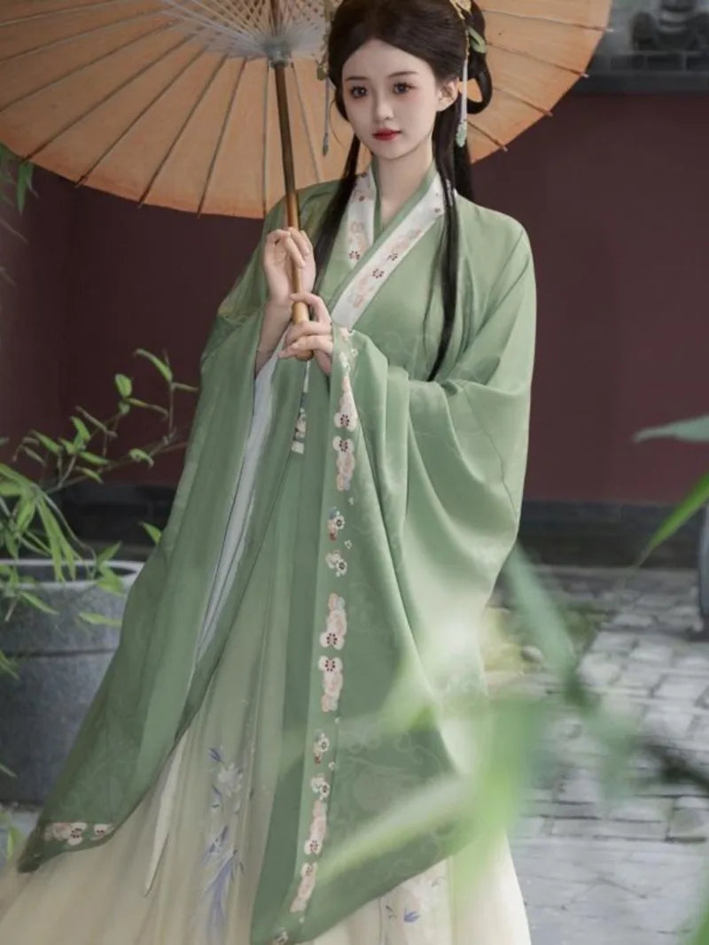 Elegant green hanfu dress with wide sleeves, flowing ancient Chinese style gown for women inspired by traditional beauty