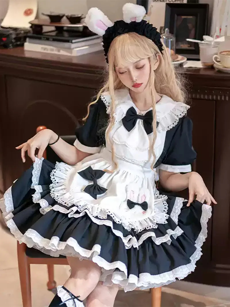 Classic black and white Lolita maid dress with lace apron and bow details, elegant original design