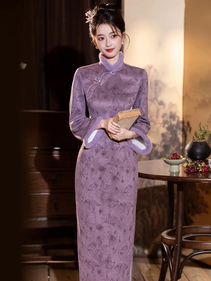 Warm purple winter qipao featuring soft suede fabric and a refined modern Chinese silhouette.