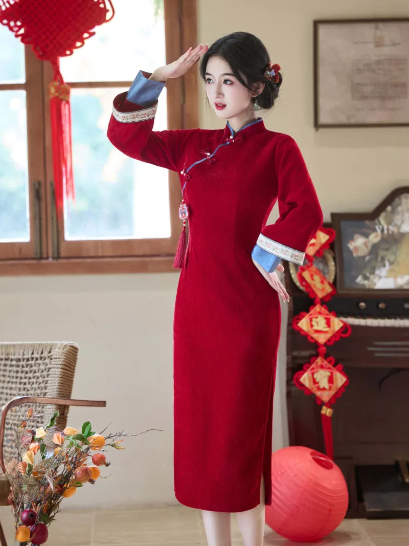 Elegant red qipao winter with long sleeves and intricate embroidery for bridal and festive occasions