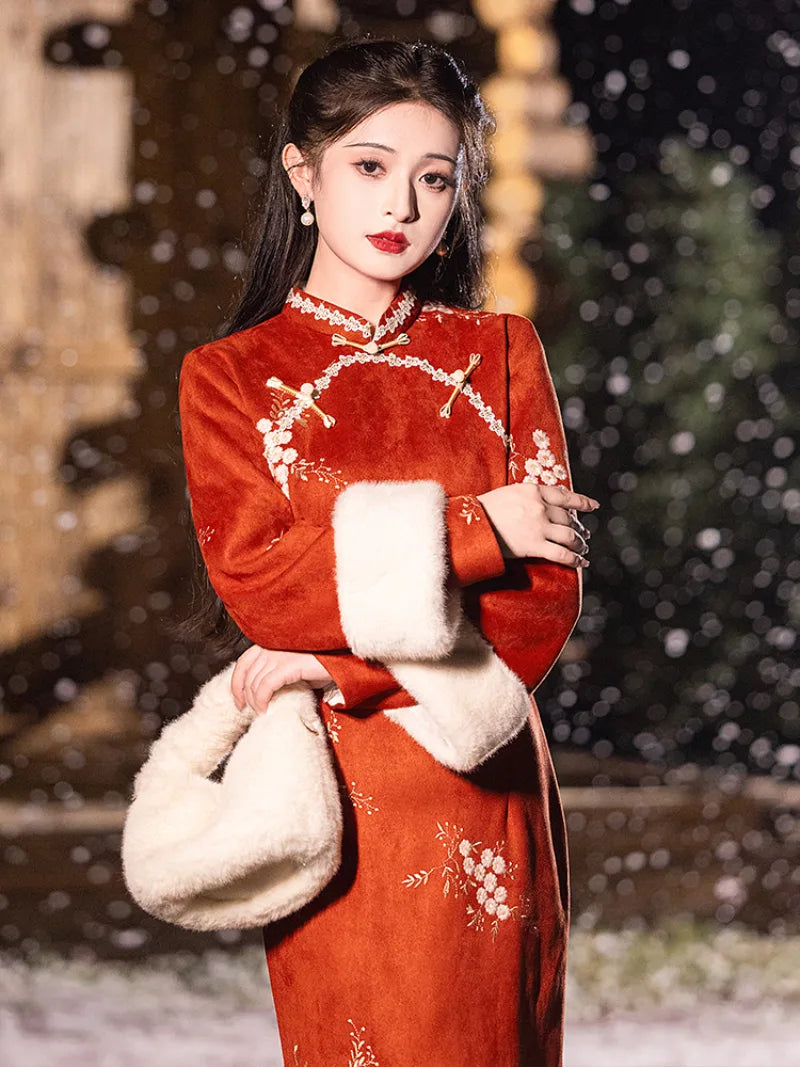 Warm winter cheongsam dress in embroidered red suede with mandarin collar and elegant side-slit design