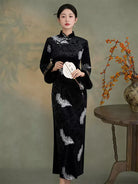 Black velvet cheongsam with silver feather embroidery and soft plush cuffs