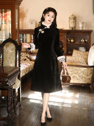 Modern black winter qipao featuring fleece lining and a sleek, flattering silhouette