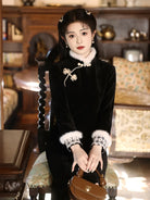 Modern black winter qipao featuring fleece lining and a sleek, flattering silhouette