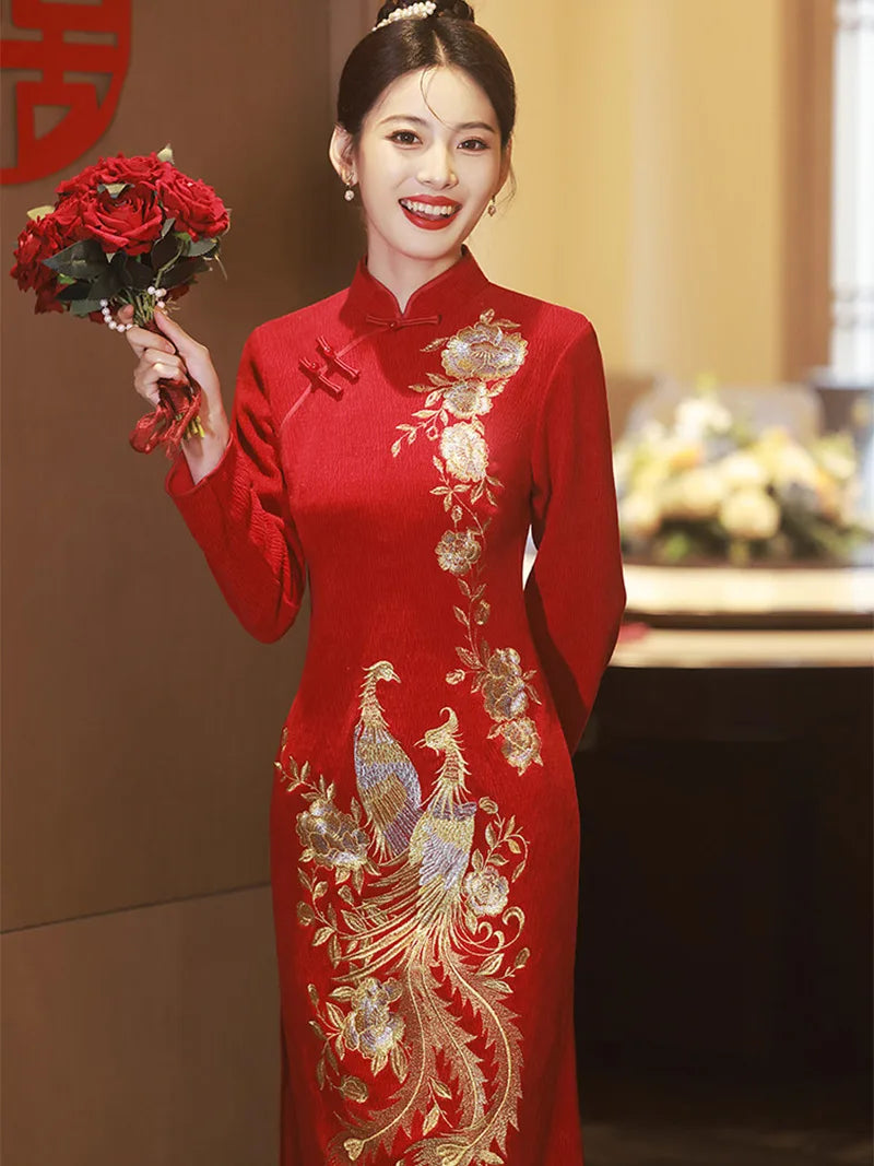 Embroidered wedding cheongsam in red satin with gold phoenix and peony design