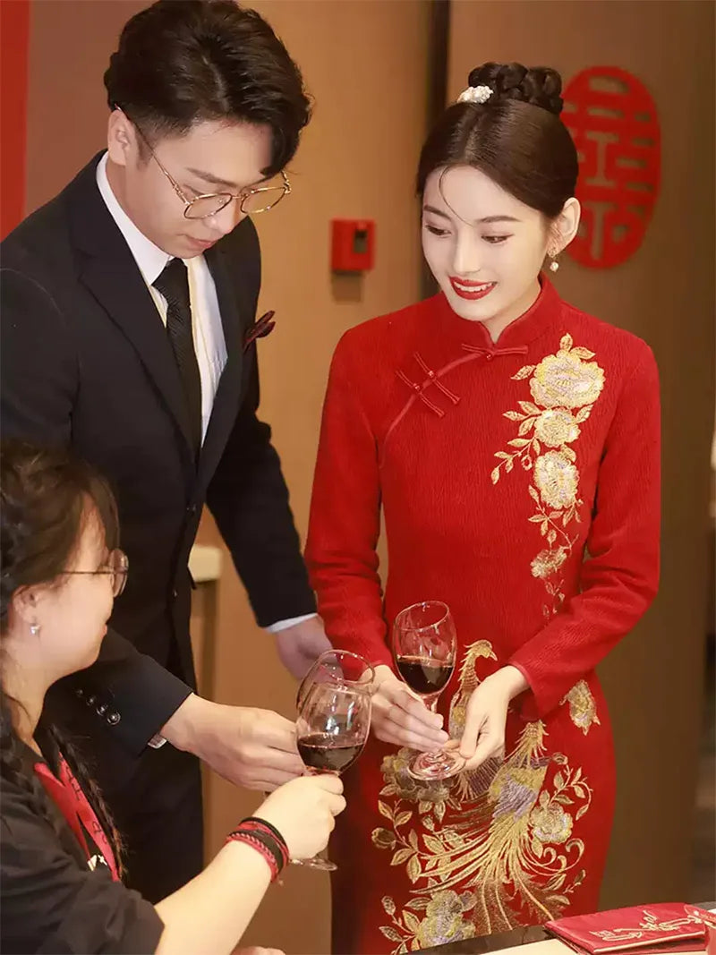 Embroidered wedding cheongsam in red satin with gold phoenix and peony design