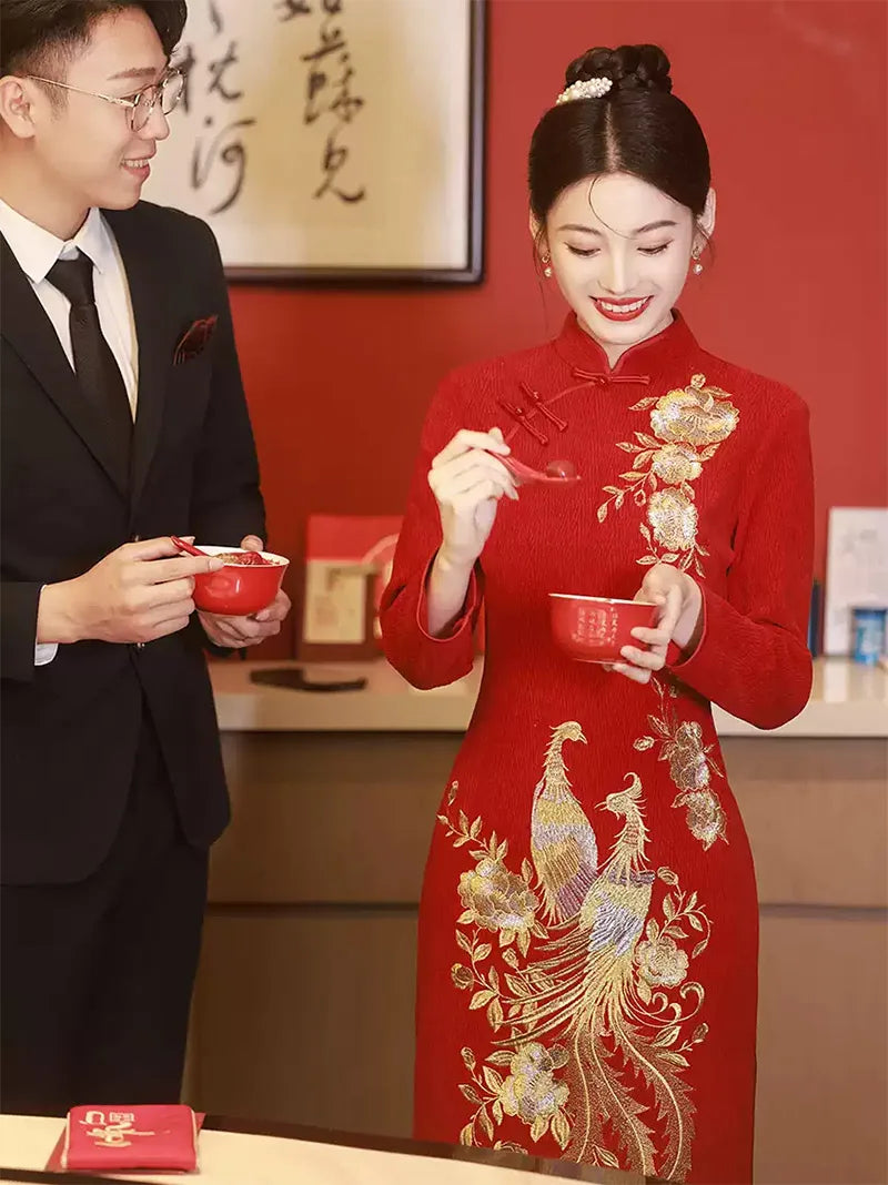 Embroidered wedding cheongsam in red satin with gold phoenix and peony design