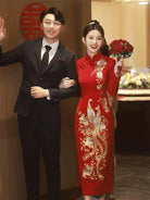 Embroidered wedding cheongsam in red satin with gold phoenix and peony design