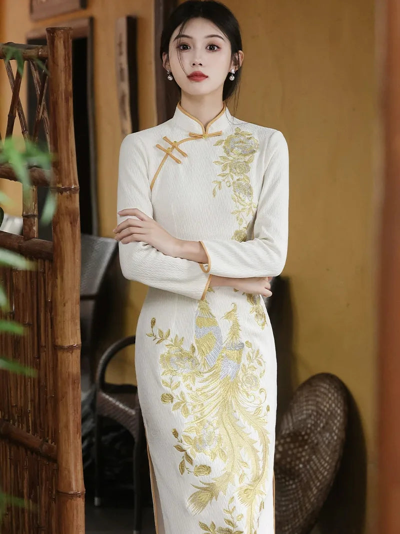 Embroidered wedding cheongsam in red satin with gold phoenix and peony design