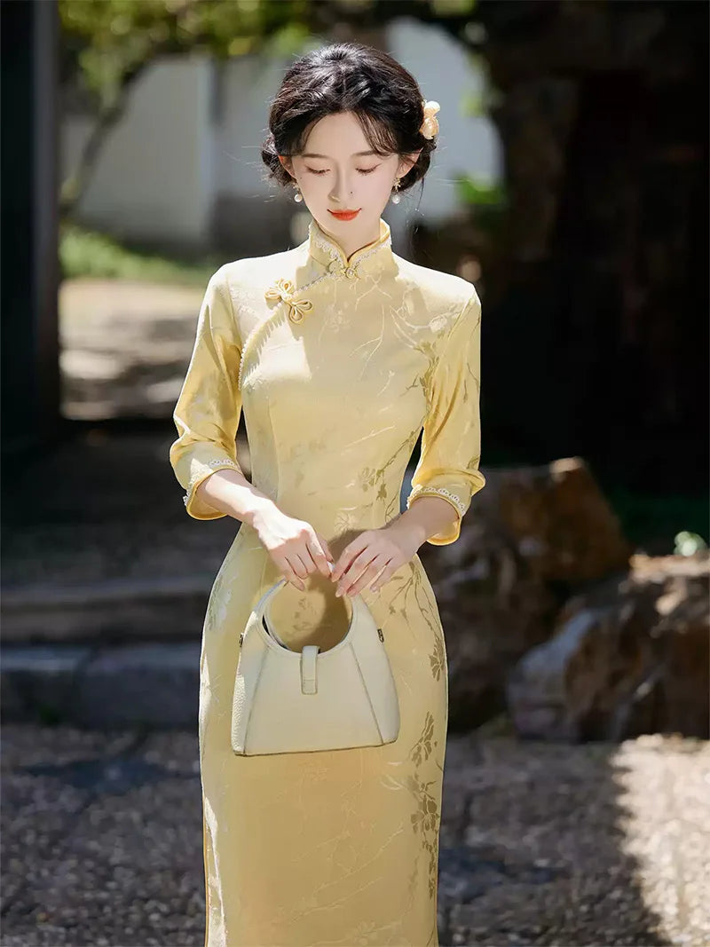 Goose yellow cheongsam with elegant jacquard details in modern Chinese styling