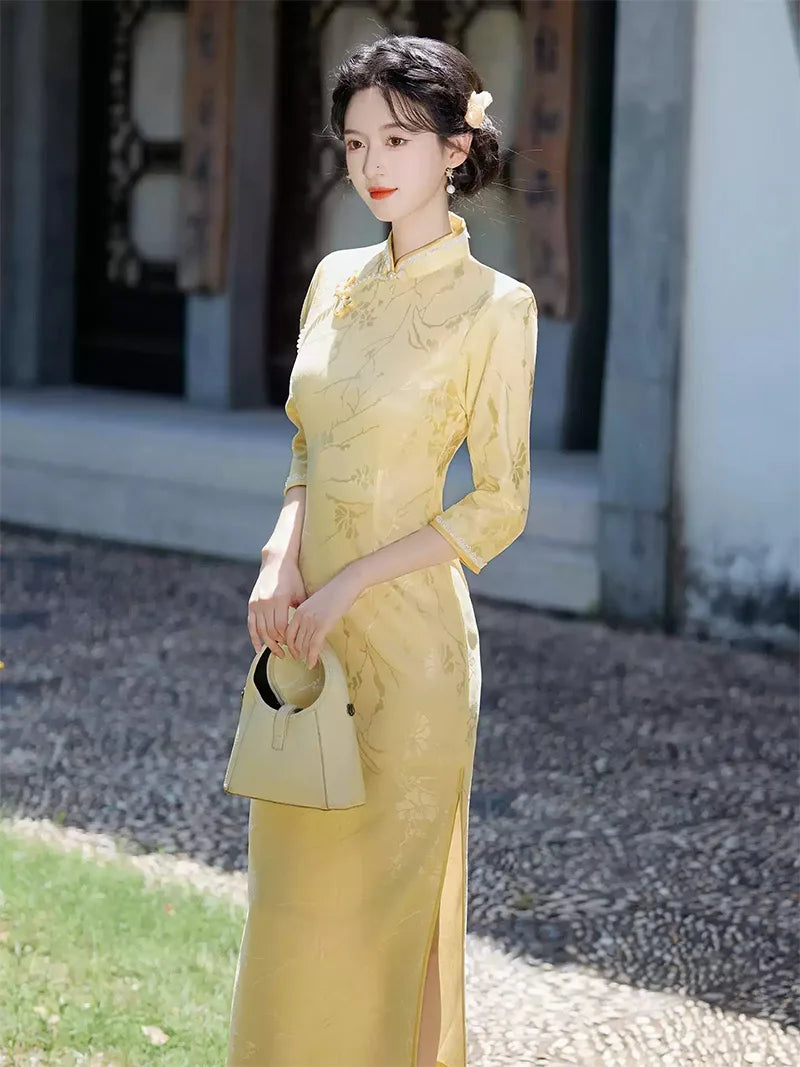 Goose yellow cheongsam with elegant jacquard details in modern Chinese styling