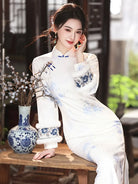 Long qipao dress with soft mist texture, blue pink floral print, and handcrafted frog buttons