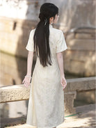 Elegant modern qipao dress in ivory with subtle jacquard texture