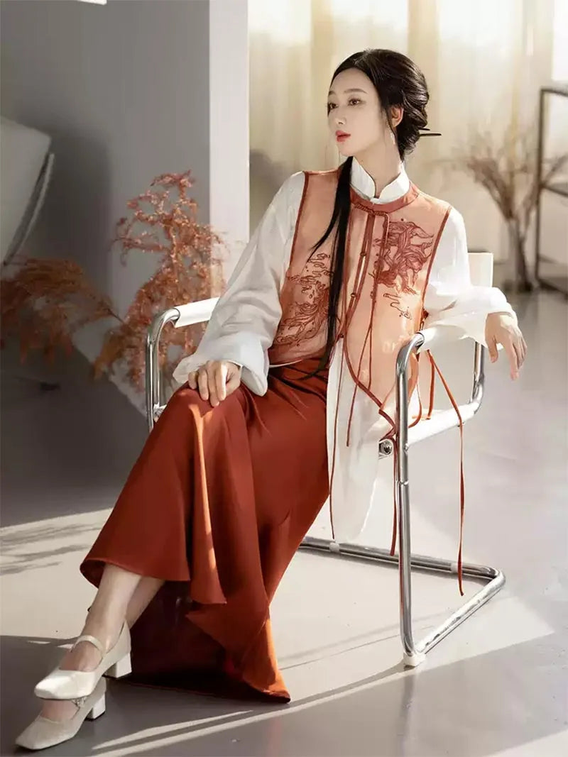 Modernised hanfu with embroidered vest, mandarin collar shirt, and fishtail skirt in orange autumn style