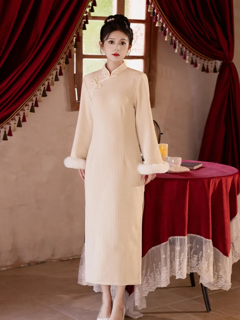Red embroidered New Year Qipao featuring winter padding and modern Chinese styling