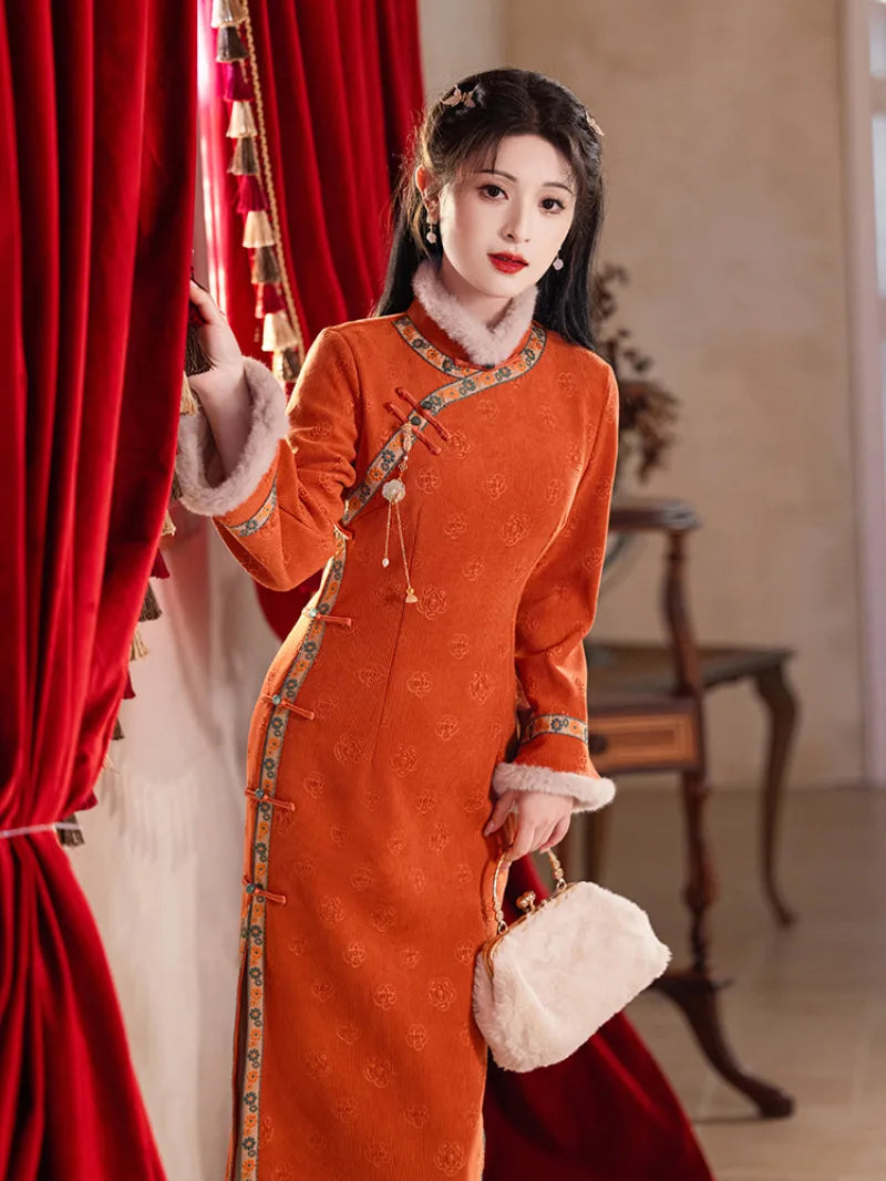 Festive orange fleece-lined winter cheongsam designed for warmth and youthful Chinese style