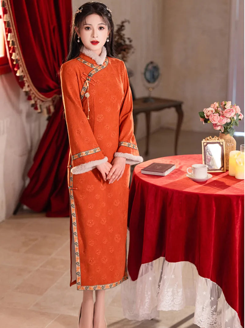 Festive orange fleece-lined winter cheongsam designed for warmth and youthful Chinese style