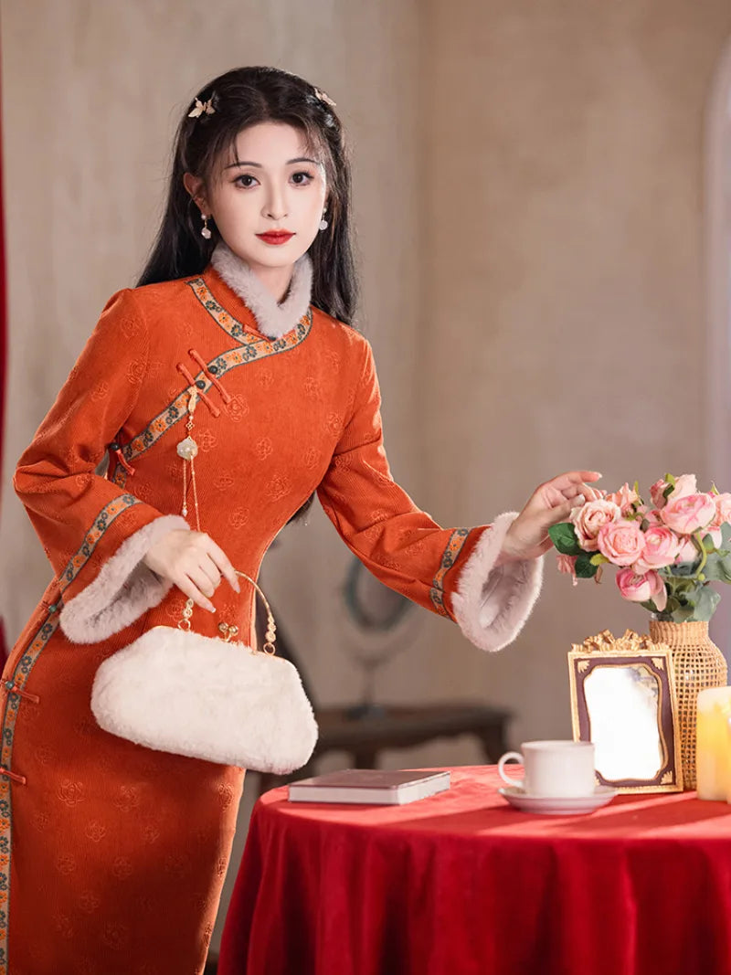 Festive orange fleece-lined winter cheongsam designed for warmth and youthful Chinese style