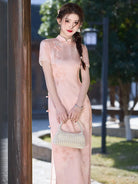Pink qiapo dress with slim fit waistline and elegant slit for summer wear