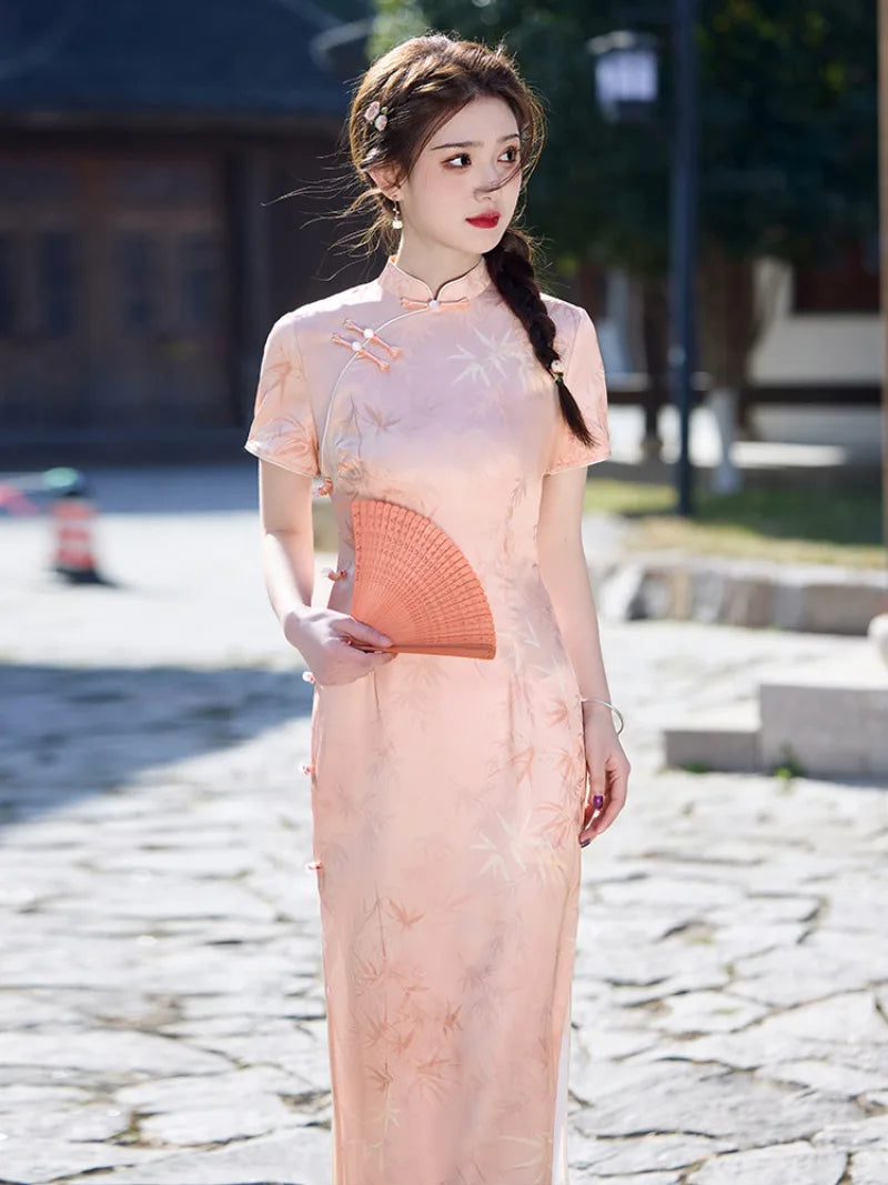 Pink qiapo dress with slim fit waistline and elegant slit for summer wear