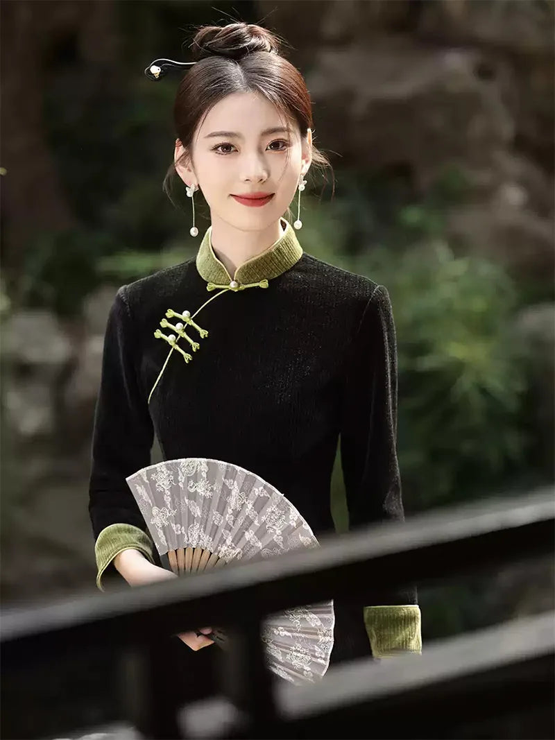 Qipao tea ceremony dress in black corduroy with jade green piping and slim silhouette