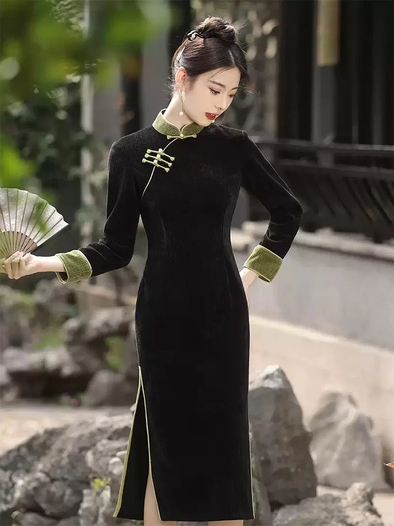 Qipao tea ceremony dress in black corduroy with jade green piping and slim silhouette