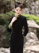 Qipao tea ceremony dress in black corduroy with jade green piping and slim silhouette
