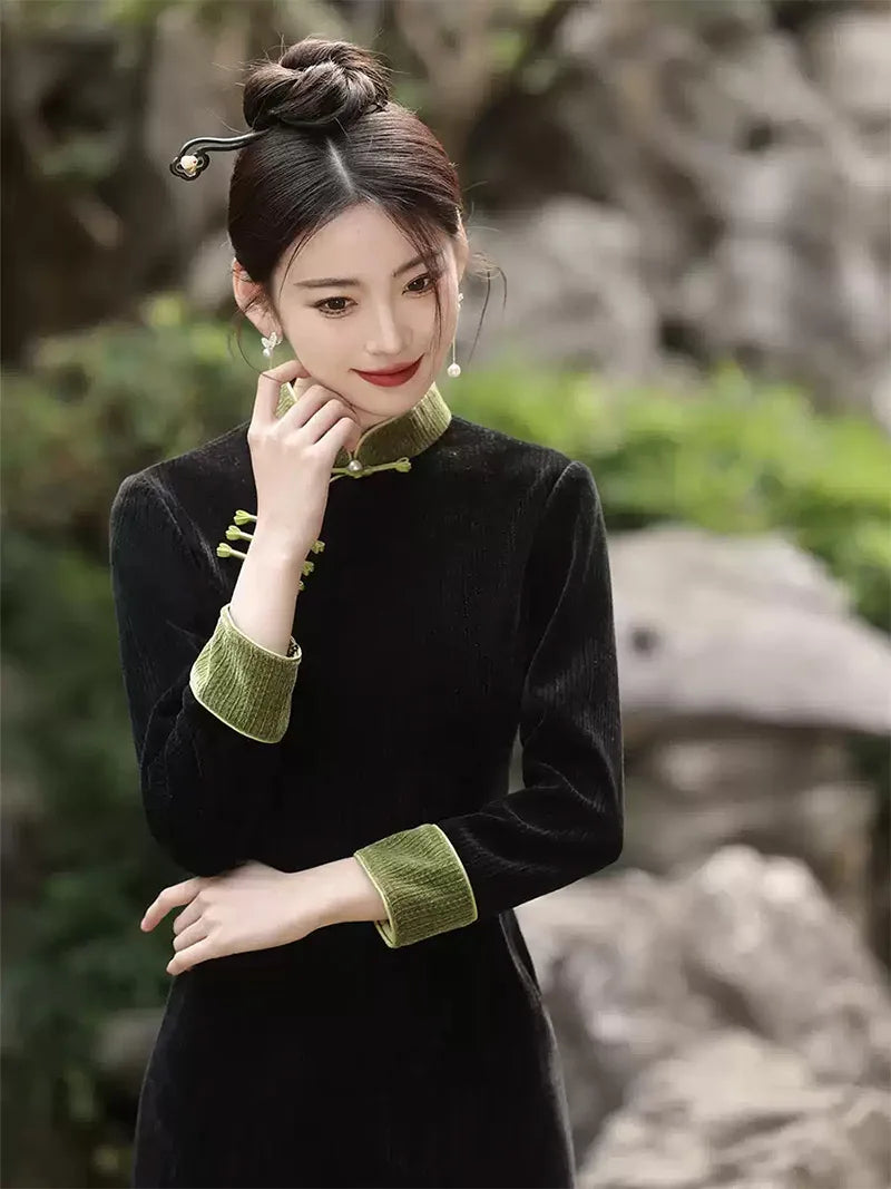 Qipao tea ceremony dress in black corduroy with jade green piping and slim silhouette