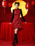 Sleeveless New Year's Qipao in glossy red with ink landscape pattern and tassel detail