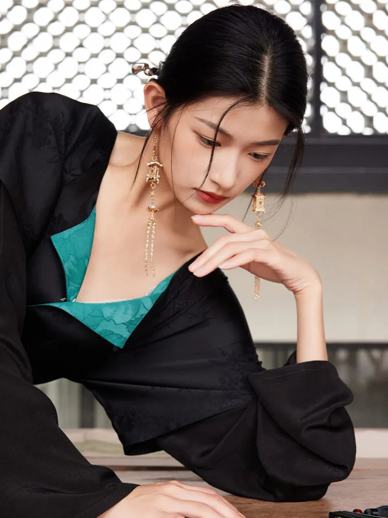 Model holding out the rust-orange hanfu skirt to show its wide flowing panels