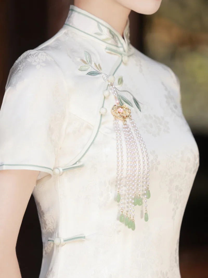 White Cheongsam dress with delicate embroidery, modern Chinese style, elegant summer silhouette