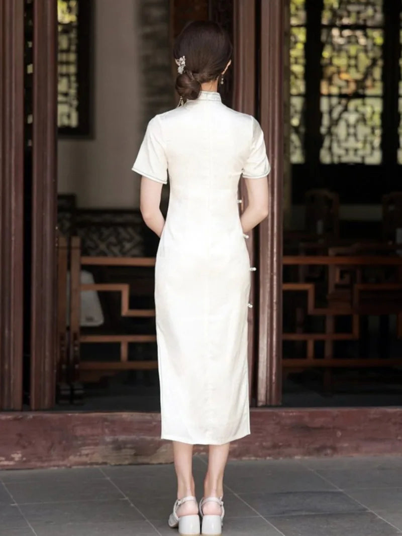 White Cheongsam dress with delicate embroidery, modern Chinese style, elegant summer silhouette