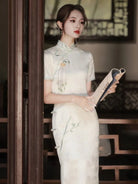 White Cheongsam dress with delicate embroidery, modern Chinese style, elegant summer silhouette