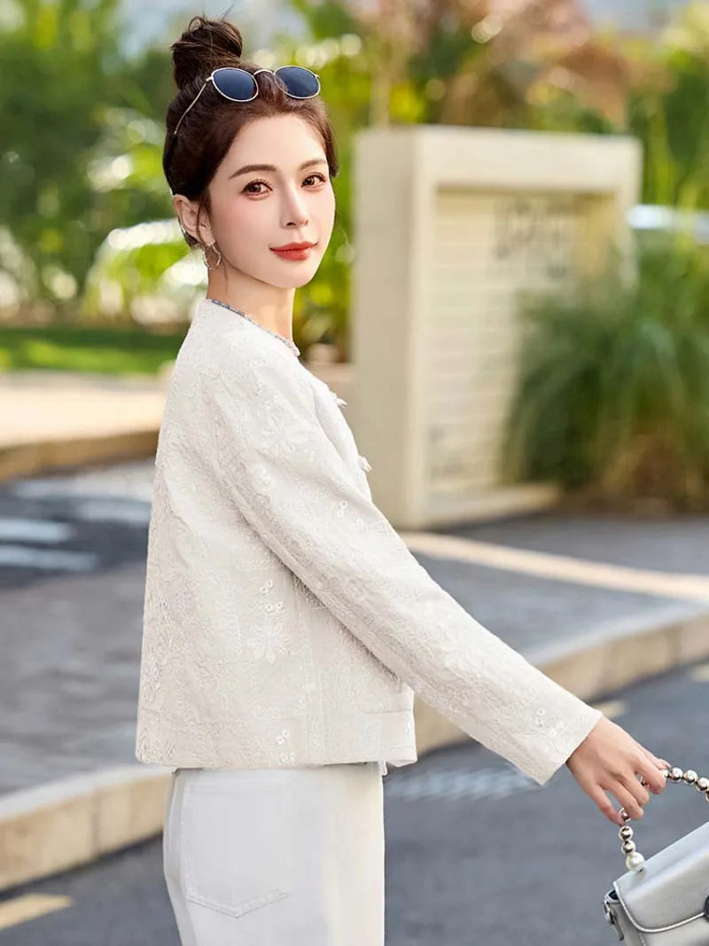 Blue Tang suit for women featuring exquisite embroidery, elegant short design, and modern Chinese fashion charm.