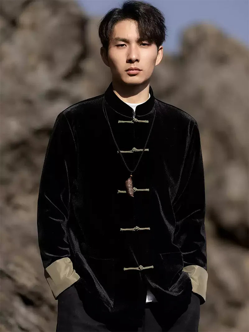 Black Tang suit for men featuring velvet fabric, frog buttons, and loose-fit Chinese traditional jacket design for spring or festive occasions.
