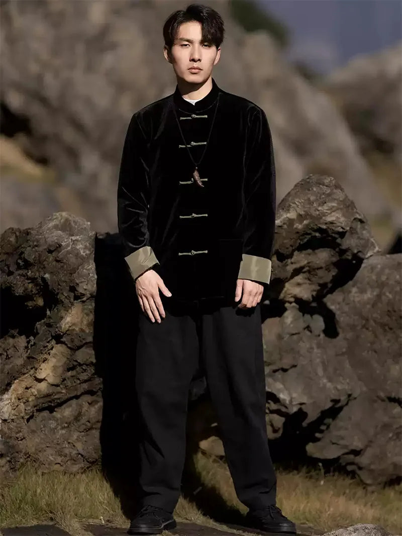 Black Tang suit for men featuring velvet fabric, frog buttons, and loose-fit Chinese traditional jacket design for spring or festive occasions.