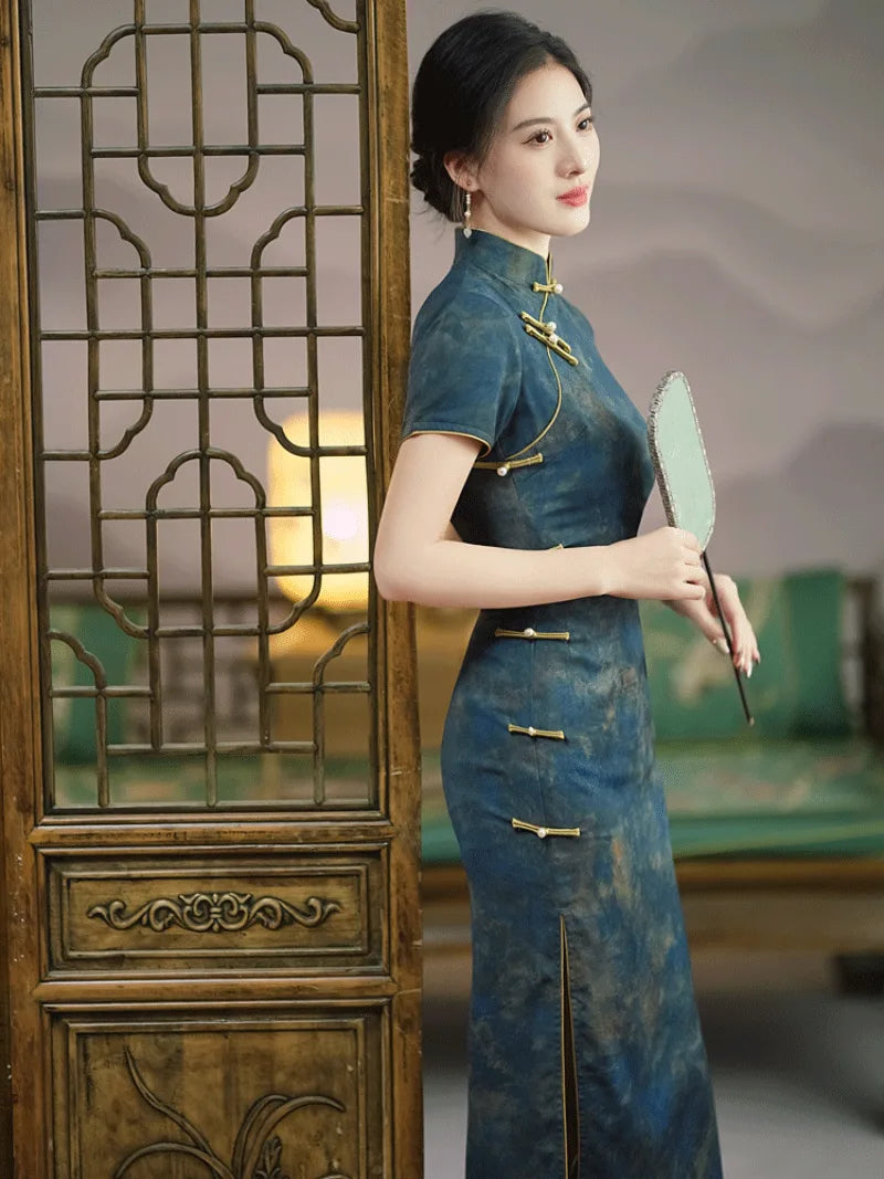 Elegant blue qipao with modern Chinese design, vintage charm, and daily wearable style