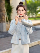 Blue Tang suit for women featuring exquisite embroidery, elegant short design, and modern Chinese fashion charm.