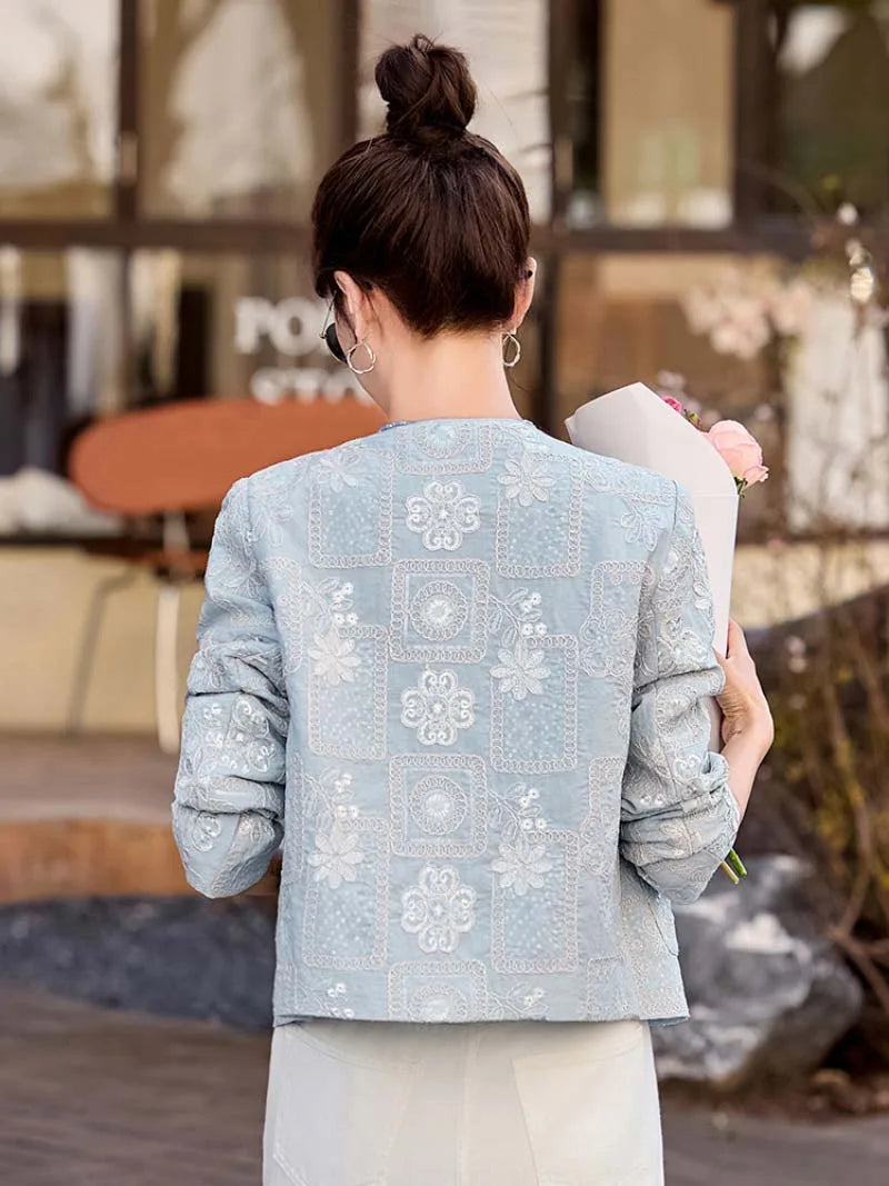Blue Tang suit for women featuring exquisite embroidery, elegant short design, and modern Chinese fashion charm.