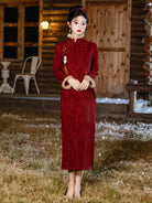 Winter cheongsam for new year in red with classic mandarin collar and warm thickened fabric