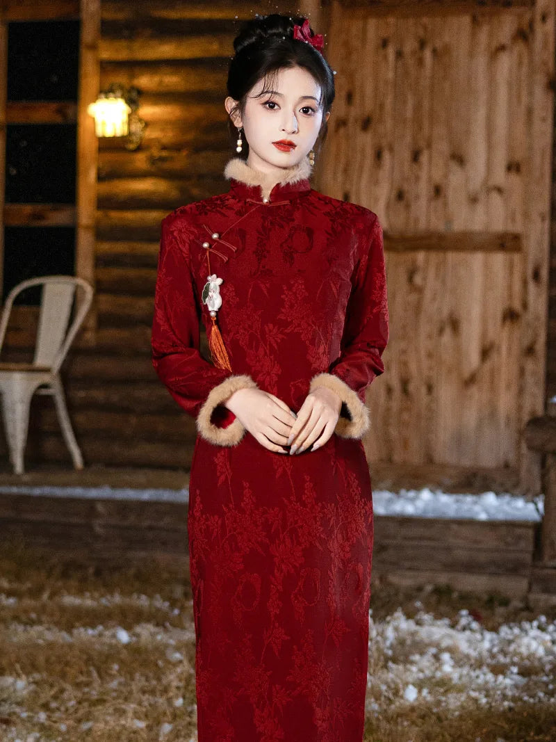 Winter cheongsam for new year in red with classic mandarin collar and warm thickened fabric