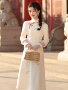 Beige cheongsam winter dress with plush collar, fleece lining and thick warm fabric in modern Chinese style