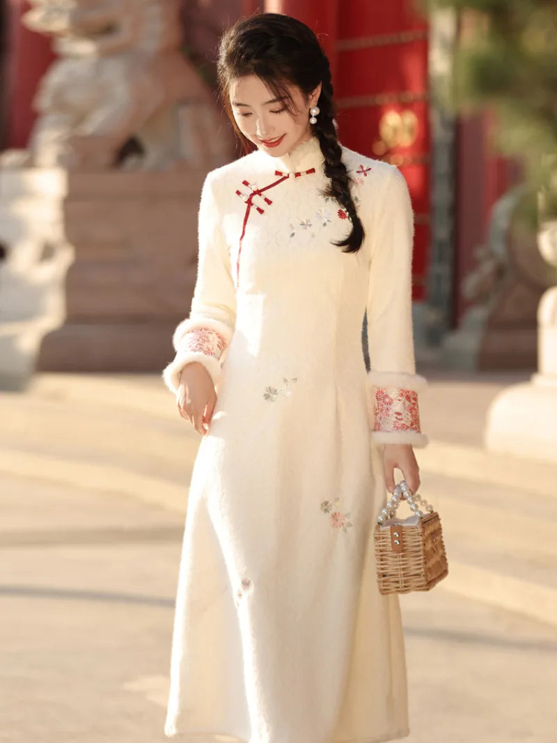 Beige cheongsam winter dress with plush collar, fleece lining and thick warm fabric in modern Chinese style