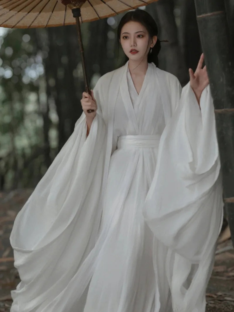 Elegant china cultural clothes featuring a white Wei Jin style wide-sleeve flowing fairy Hanfu dress