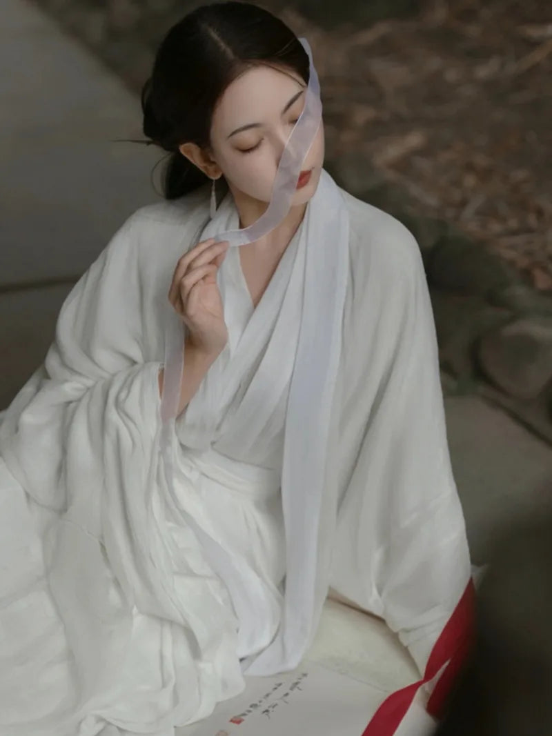 Elegant china cultural clothes featuring a white Wei Jin style wide-sleeve flowing fairy Hanfu dress