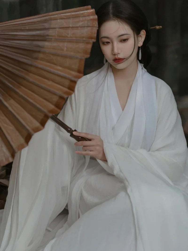 Elegant china cultural clothes featuring a white Wei Jin style wide-sleeve flowing fairy Hanfu dress