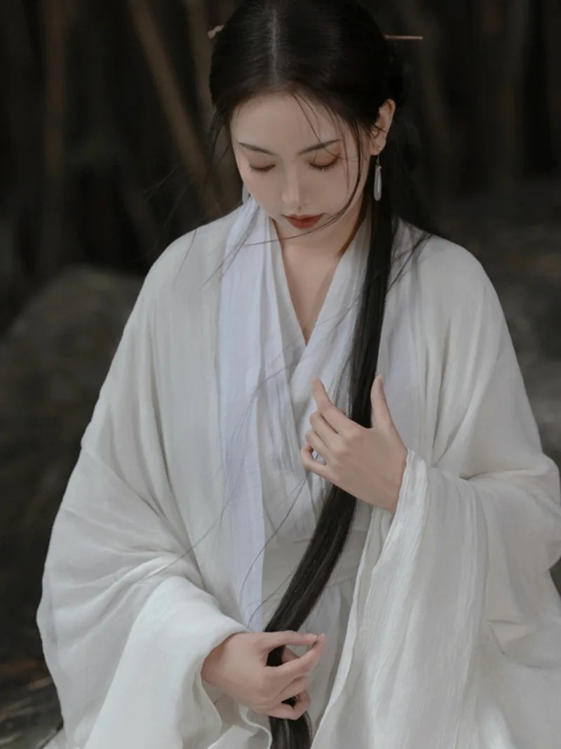 Elegant china cultural clothes featuring a white Wei Jin style wide-sleeve flowing fairy Hanfu dress