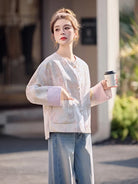 Chinese Tang Suit Jacket for women with jacquard fabric, traditional pankou buttons, modern Chinese style, elegant design